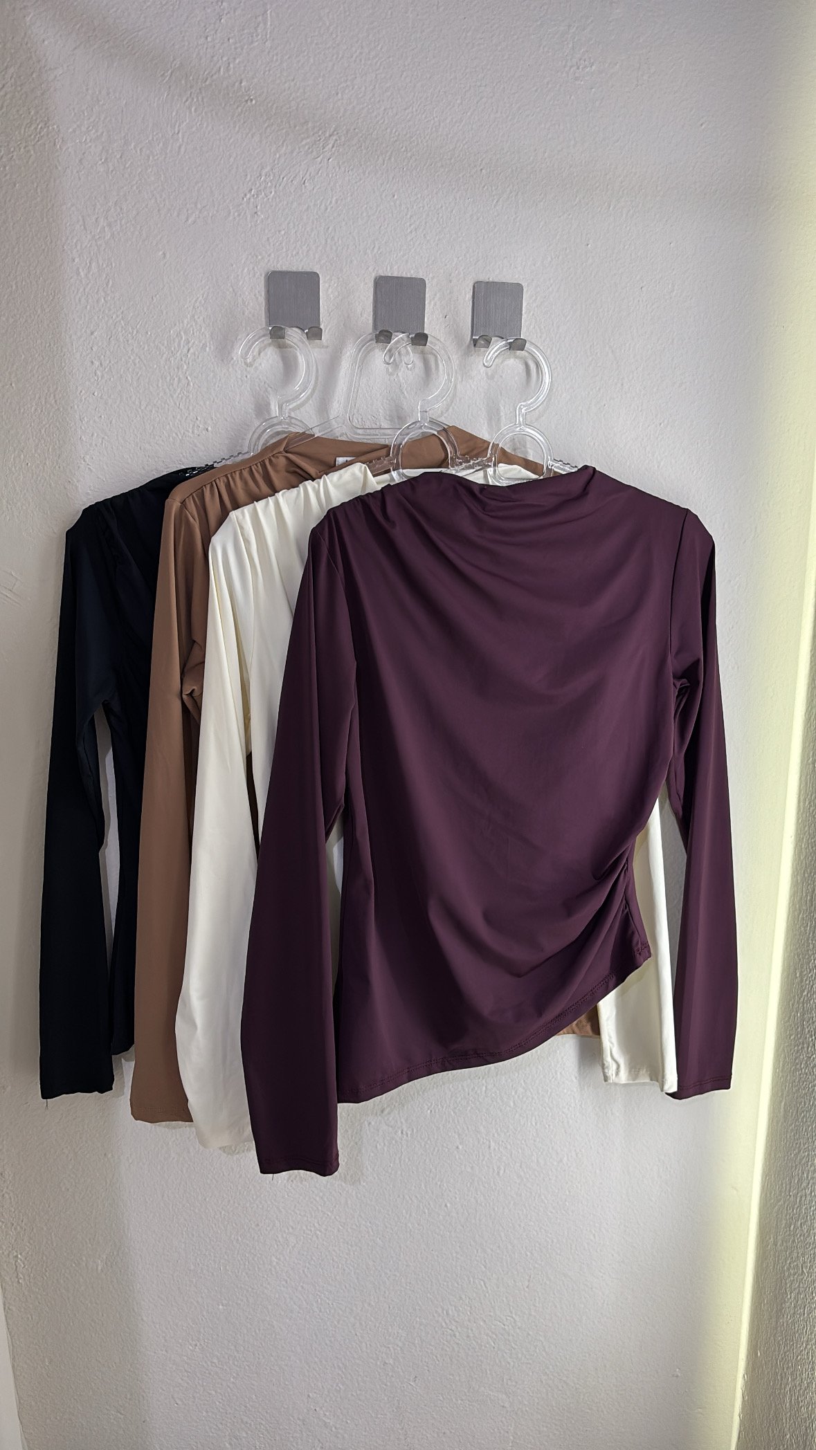 Blusa assimétrica manga longa